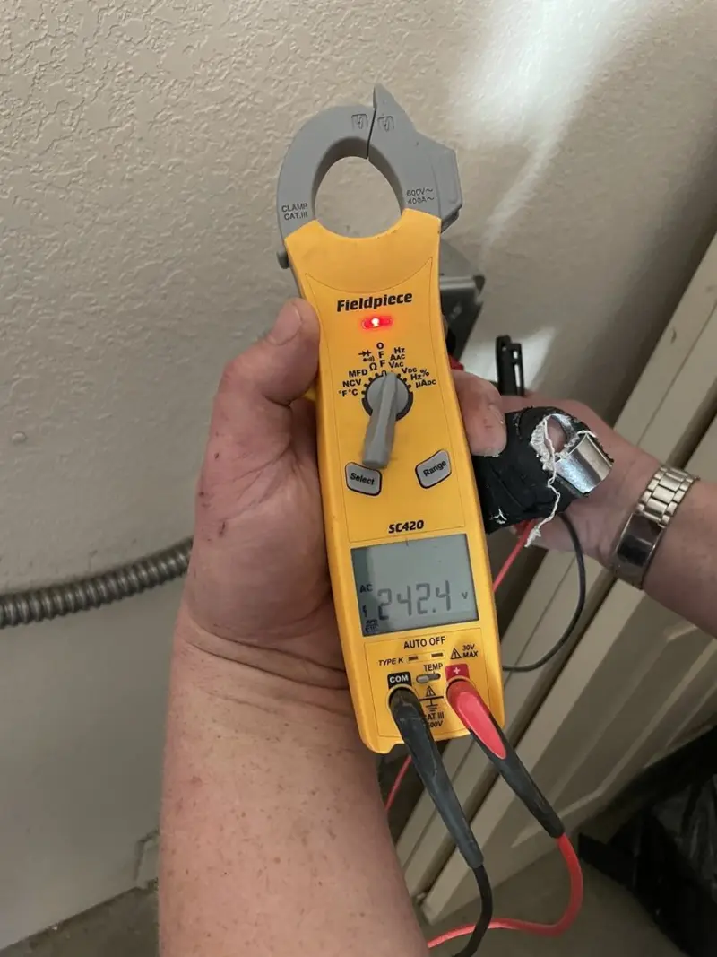 Voltage testing with clamp meter during Electrical Installation Services in Flagler Beach